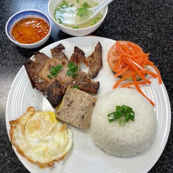 Huynh Restaurant signature dishes Goi Cuon (Spring Rolls), Char-grilled Pork over Rice Vermicelli (Bun Thit Nuong), Duck Noodle Soup (Mi Vit Tiem), Com Tam Bi Suon Cha